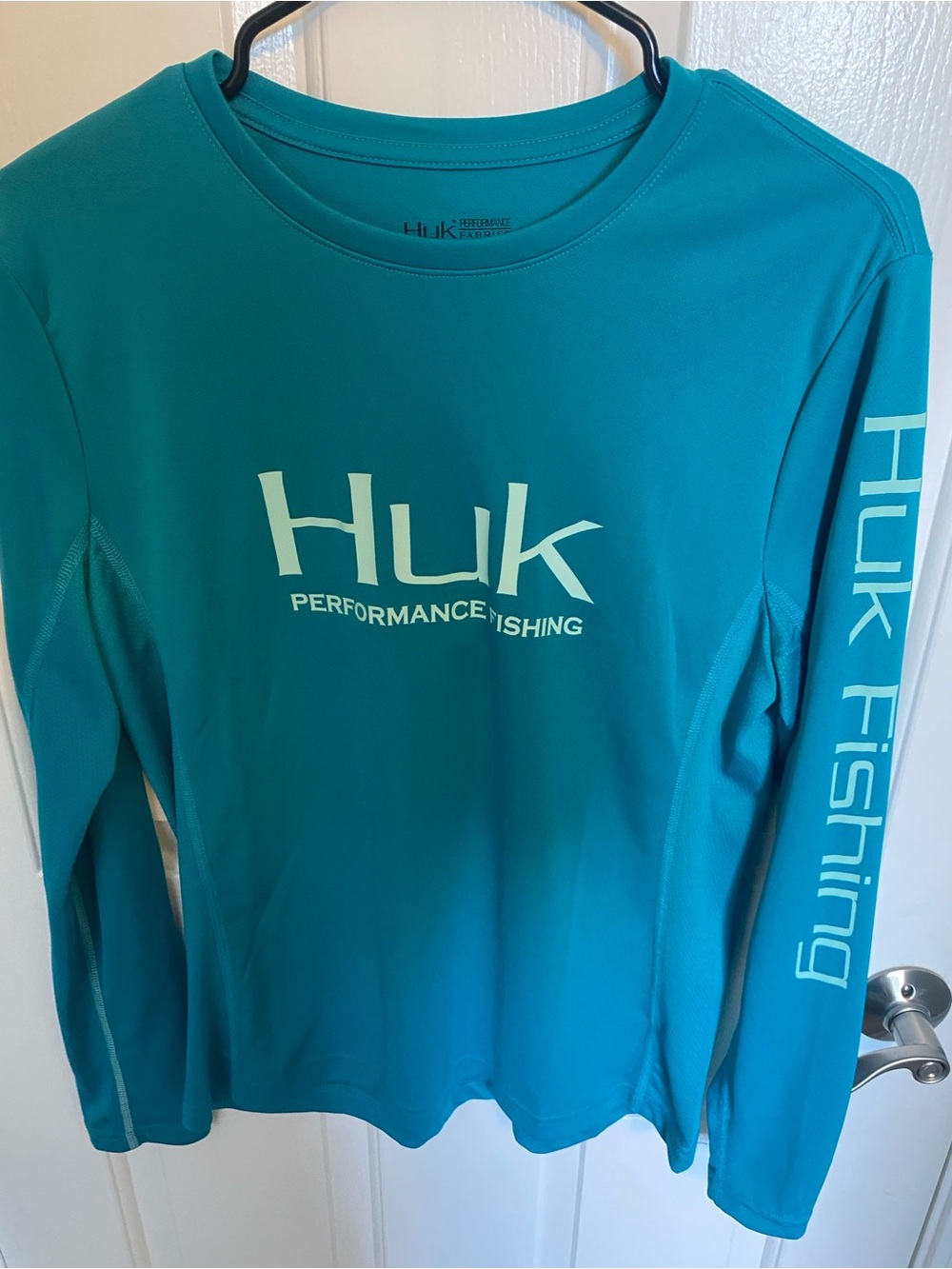 Huk Women's Long Sleeve Performance Top in Teal with White Logo